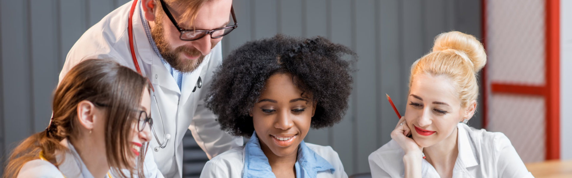 Four healthcare staff smiling