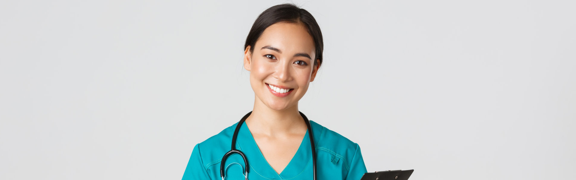 A female healthcare staff smiling