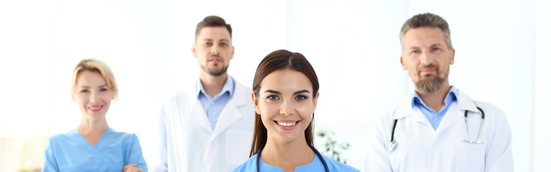 Four healthcare staff smiling