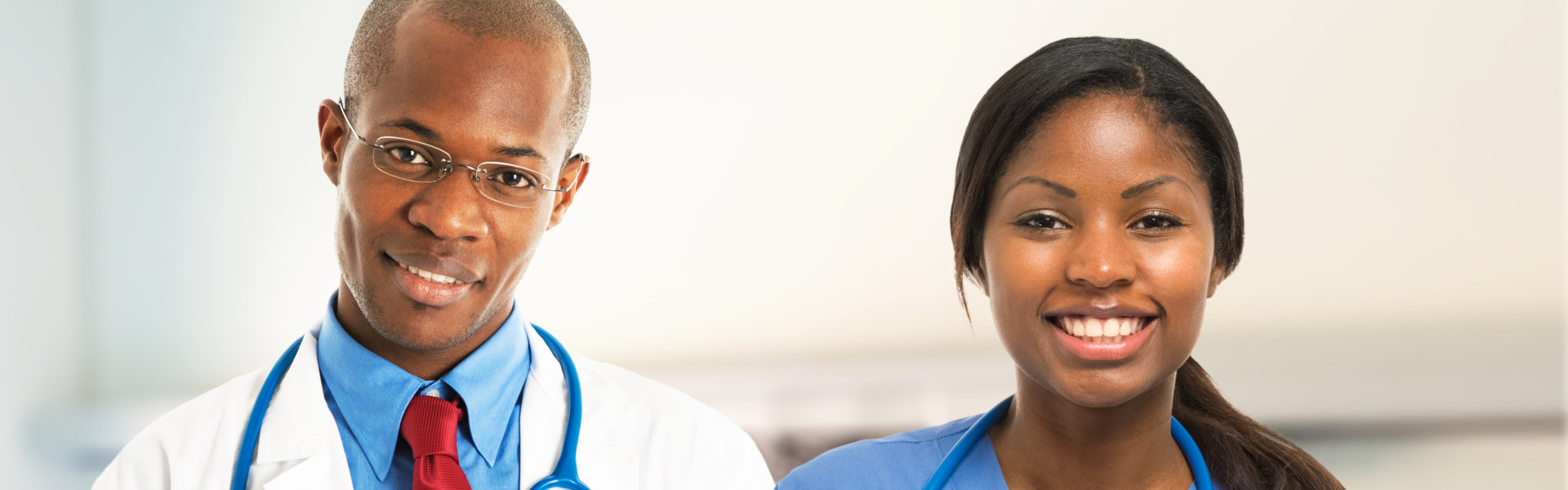 Two healthcare staff smiling